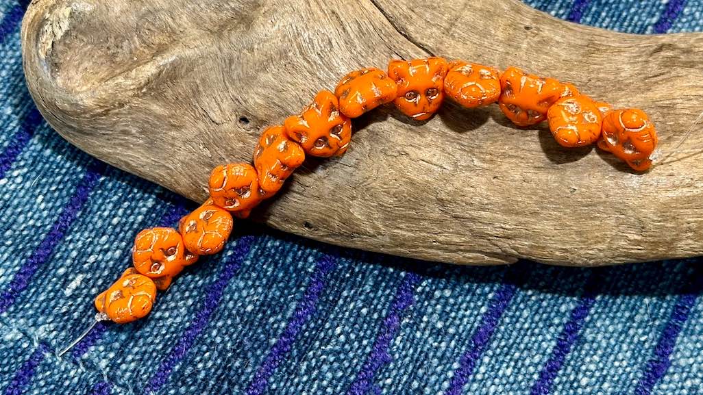 Czech Glass Strand - Pressed Glass Cat Head - Opaque Orange Bead With Bronze Wash - 11mm - 12 Beads