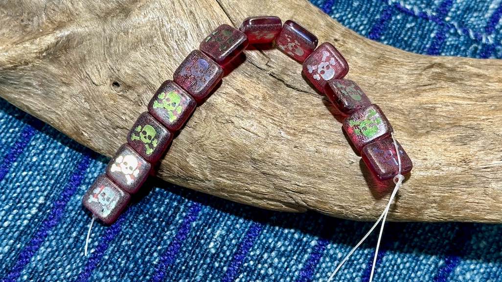 Czech Glass Strand - Square - Transparent Fuchsia Bead with AB Laser Etched Skull & Crossbones - 10mm - 12 Beads